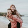 man-carrying-woman-beside-seashore.jpg man carrying woman beside seashore